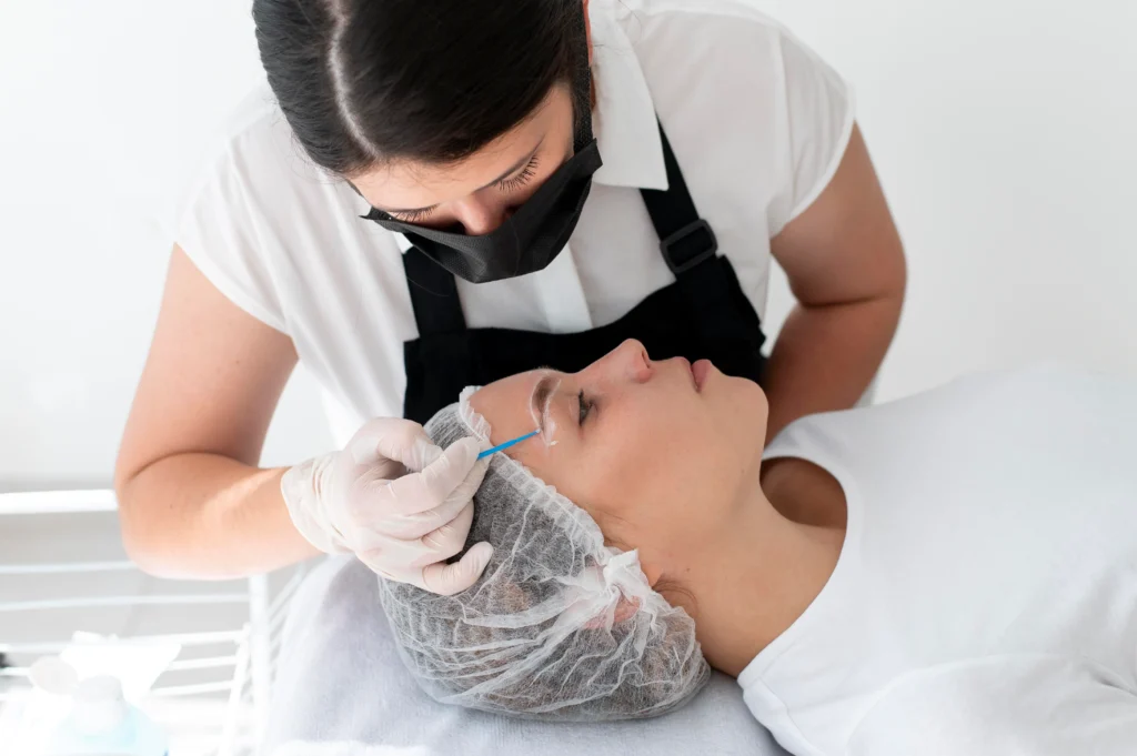 An dermatologist treatment microblading to the patient